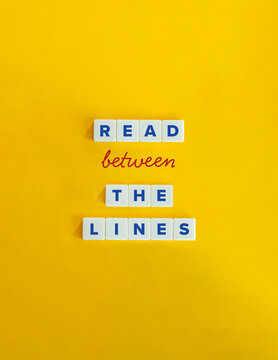 Read Between The Lines Expression and Banner. Understand Deeper or Hidden Meaning, beyond the Literal Words.