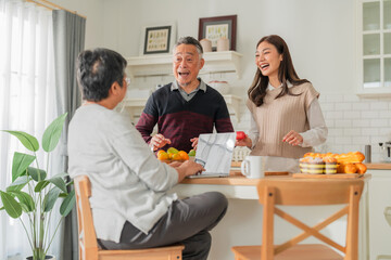 mother day family relation bonding at home asian family mother father and daughter enjoy cuddle conversation morning lifestyle hapiness joyful moment while stay at kitchen area home love bonding