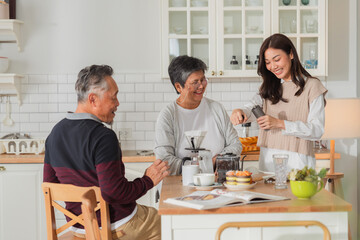 happiness asian family bonding family reunion fresh coffee bean drip process together in kitchen Drip coffee Mature woman pouring coffee cup for senior woman sitting at dining table lifestyle family