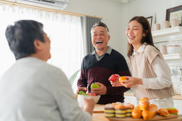 mother day family relation bonding at home asian family mother father and daughter enjoy cuddle...