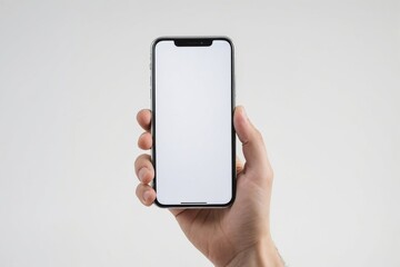 Hand holding smartphone with blank screen on white background