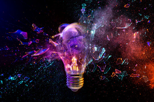 Light bulb exploding with colorful powder effect