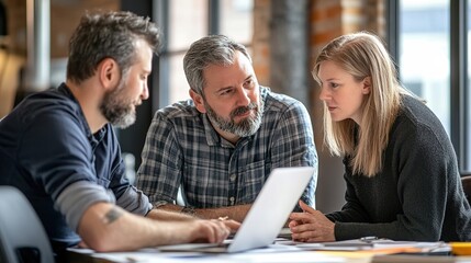A creative team discussing branding strategies, with a focus on visual identity and advertising consistency