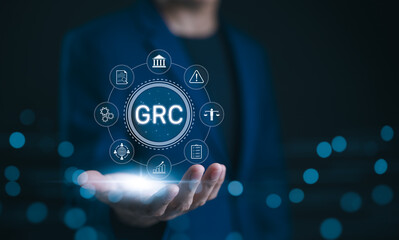 GRC, Governance Risk Compliance Concept. Businessman with GRC governance, risk, compliance icons,...