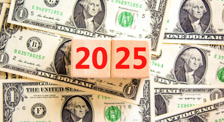 Business concept of 2025 new year symbol. Beautiful wooden cubes with number 2025 Happy new year. Dollar bills. Beautiful background from dollar bills, copy space. Business 2025 happy new year concept