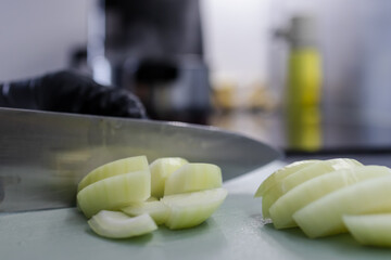 Slicing onions close-up. Onions for shish kebab. cooking