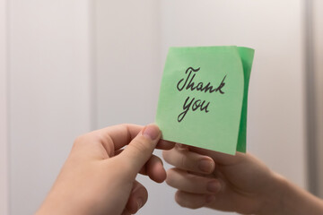 A sticker on the mirror that says “thank you”
