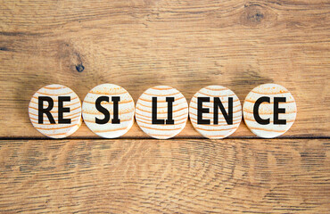 Resilience symbol. Concept word Resilience on beautiful wooden circles. Beautiful wooden background. Business resilience concept. Copy space.