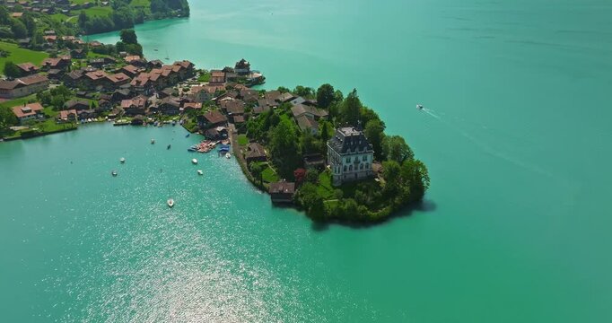 Aerial view of the Seeburg an castle on the lake. Aerial view of Iseltwald on Brienz lake in Switzerland, tranquil landscape of Swiss nature, tourism in Switzerland concept. Switzerland, Iseltwald