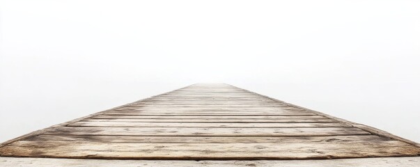 Old wooden pier disappearing into the fog on a lake