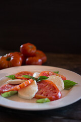 A refreshing Caprese salad, enhanced by the juiciness and unique flavor of Margarita Island tomatoes, combined with fresh mozzarella and aromatic basil, a tribute to freshness and simplicity.