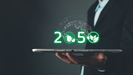 ESG for Environment Social and Governance,net zero 2050,human are raising the planet to save energy,and reduce global warming,idea for environment conscious business,reducing greenhouse gas emissions.