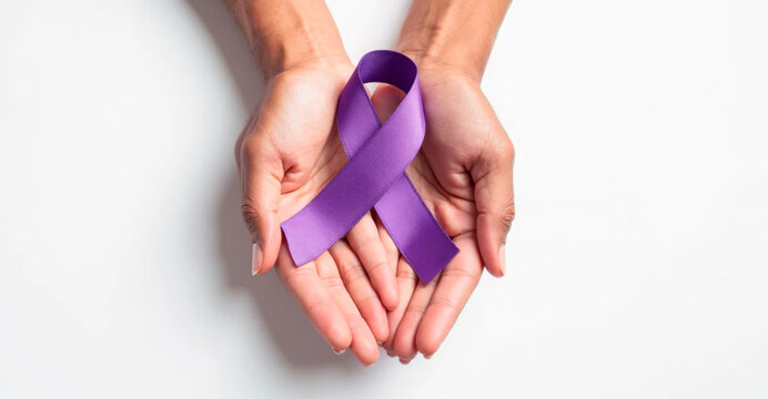 Hands carefully holding a purple ribbon, symbolizing support and awareness for a variety of causes, against a light background
