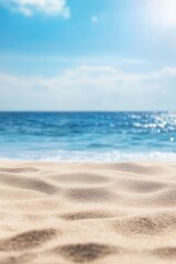 Fototapeta premium Serene beach scene with soft sand and a calm blue ocean under a bright sky, perfect for themes of relaxation, summer, and tranquility.