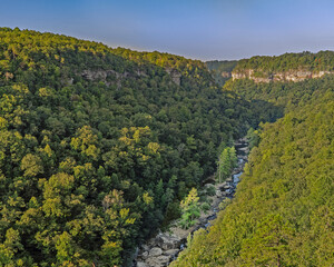 In summer, the water levels are low, exposing the rocky riverbed in the canyon below, as seen from the Wolf Creek Overlook on the Little River Canyon Rim Parkway in the National Preserve in Alabama.