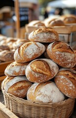 A stack of round sourdough loaves resembling rye or wheat bread with rough crusts