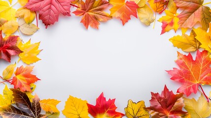 A colorful arrangement of autumn leaves framing a blank space for text or design.