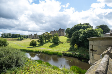 Fototapeta premium View of Alnwick Castle from the Lion Bridge over the River Aln in Northumberland