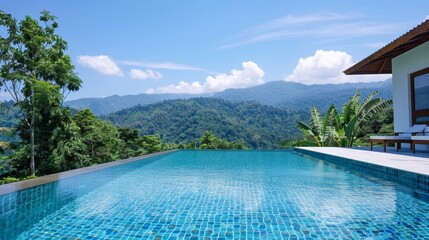 A large pool with a beautiful view of the mountains and the water