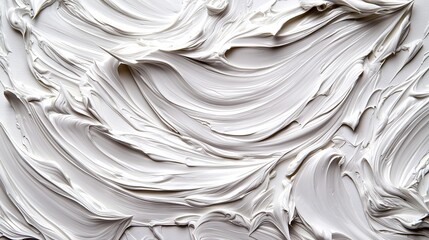   A close-up view of a white cake with icing on its icing and white icing on the top of it