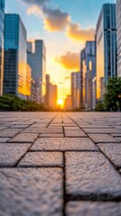 A captivating cityscape showcasing a beautiful sunset, framed by modern buildings and patterned pavement. Perfect for urban scenes.