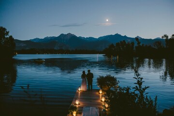 Obraz premium Serene Moonlit Lakeside Wedding with Couple Exchanging Vows