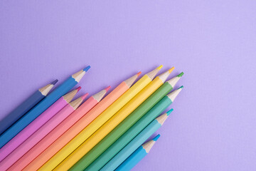 Colored pencils on colored background. Back to school concept. Draw