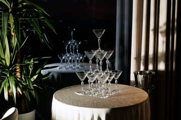 Champagne Glasses in a Pyramid, Ready to Be Filled and Plant Decoration