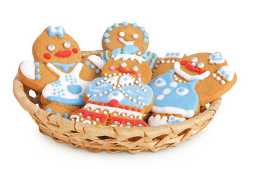 christmas gingerbread cookie in a wicker basket isolated on white background