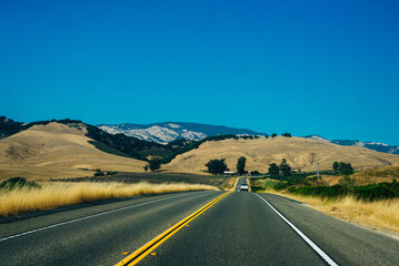 yellow line road along the hills in the USA