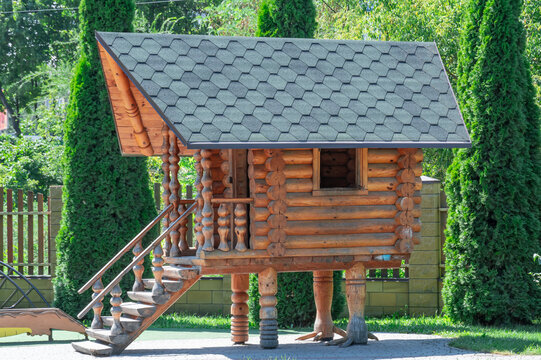 Wooden hut on chicken legs on playground. Fairytale character is house of baba yaga. Entertainment and games for children in park. Mystical and fairy being grandmother yaga in slavic folklore.