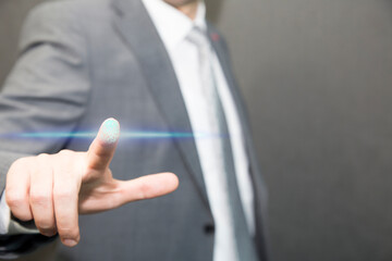 Close up of businessman touching digital screen with finger