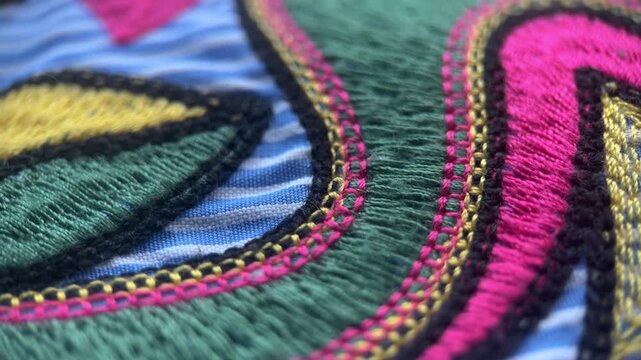 Colored Embroidery On Fabric Background