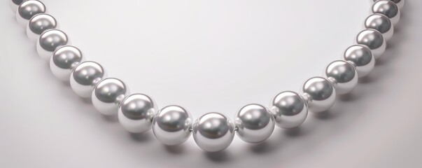 Obraz premium Elegant pearl necklace on white background, 4K hyperrealistic photo