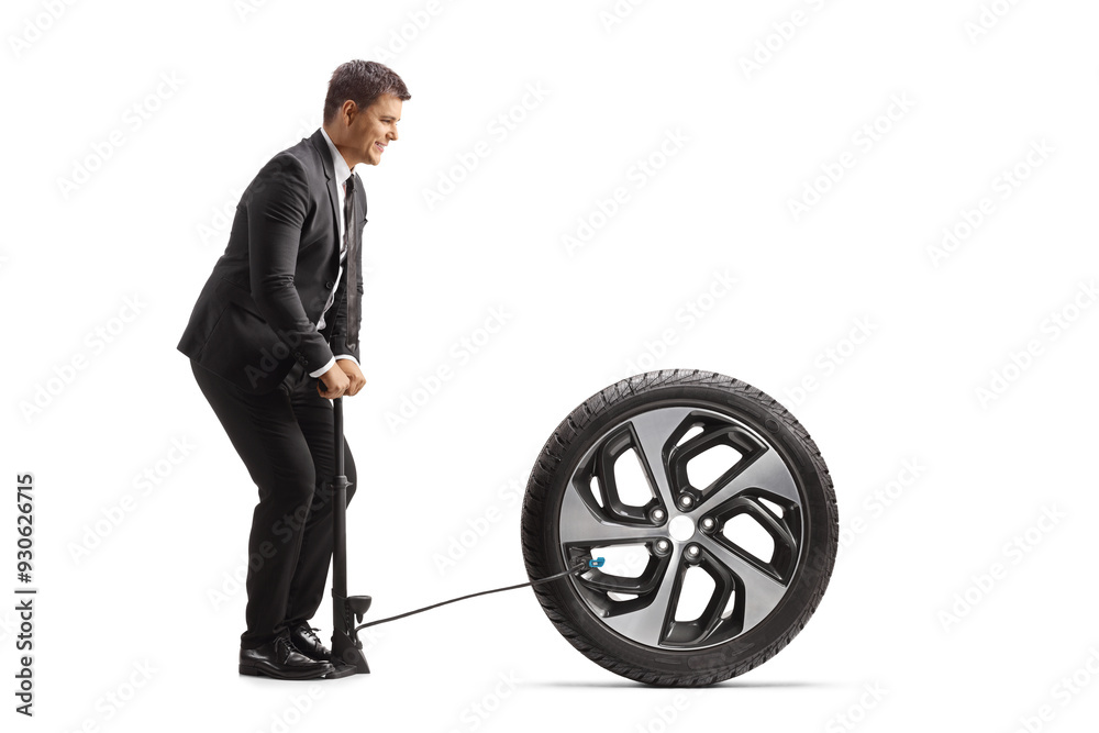 Canvas Prints Businessman pumping a car tire