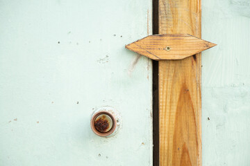 Old door with handle and lock from a barn at a dacha in Ukraine