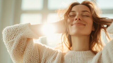A woman with beautiful features enjoys the warm sunlight, eyes closed and smiling, wearing a cozy sweater, capturing a serene and blissful indoor moment.