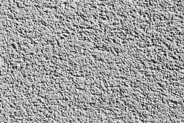 Gray concrete wall texture with rough stone pattern, grainy grunge details, distressed surface, and dusty effect. Architectural background. Abstract design project backdrop.