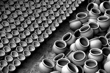 Skilled potter shaping the clay into pot on spinning wheel, Indian earthenware.