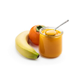 Persimmon and banana puree in glass jar isolated on white