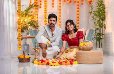 Onam background Kerala couple making Onam flower decoration, Happy Onam greeting image