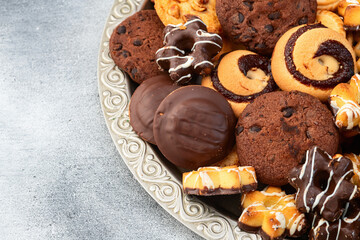 Mix of cookies . Many unhealthy snacks . Top view
