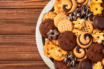 Mix of cookies . Many unhealthy snacks . Top view