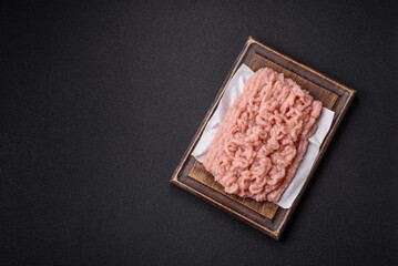 Fresh raw chicken mince with salt and spices