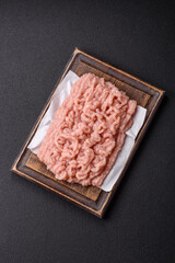 Fresh raw chicken mince with salt and spices