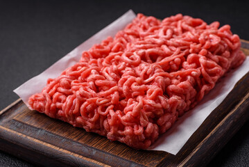 Fresh raw ground beef with salt and spices