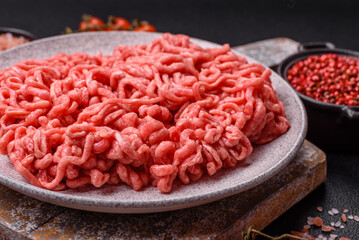 Fresh raw ground beef with salt and spices