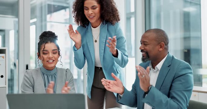 Business, people and celebration in office, laptop and success of pitch, desk and collaboration in bank. Corporate, women and reading of email by employee, proposal and congratulations for deal