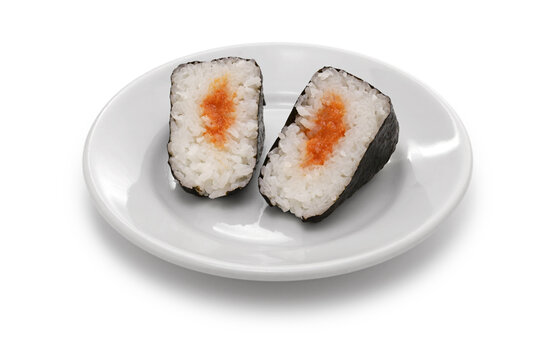 Onigiri( rice ball) cut in half. The filling is mentaiko(spicy fish roe). Traditional Japanese food.