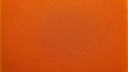 A close-up of a bright orange, textured surface.